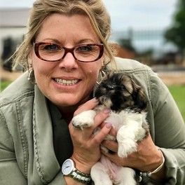 Animal Health Dir. Michelle L. with cute puppy