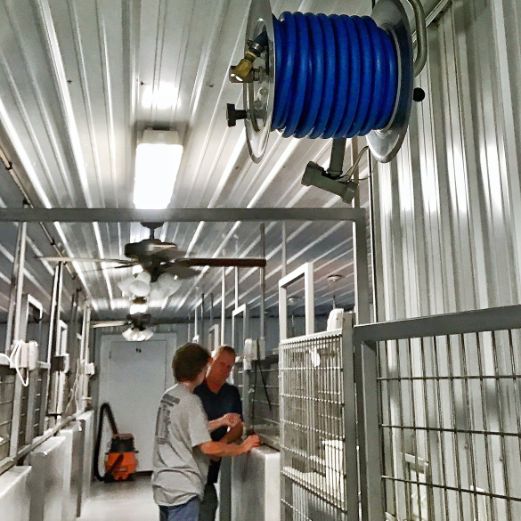 Inspecting High-Tech Indoor Kennels