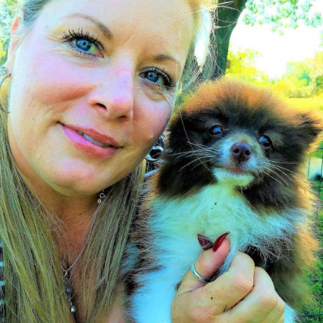 Michelle L. cuddles Pomeranian