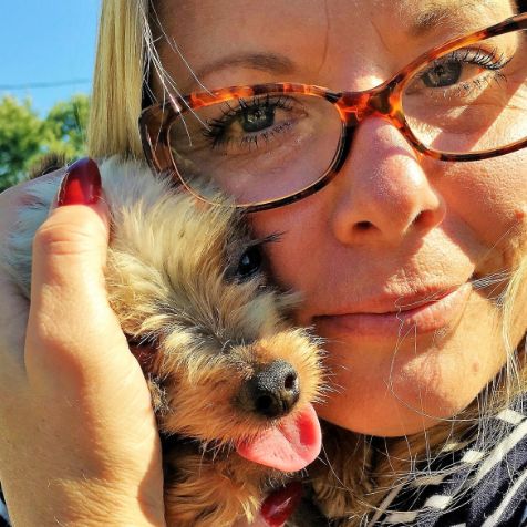 Michelle L. cuddles Yorkshire Terrier