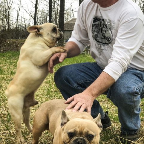 Jim with two of his French Bulldogs