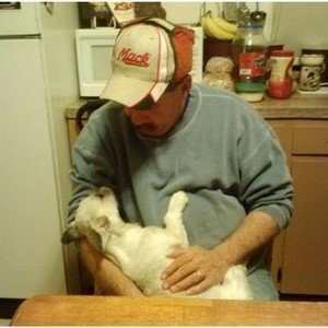 Arminta\'s husband playing with a French Bulldog