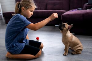 Domestic pets concept. Portrait of kid with puppy, best friends