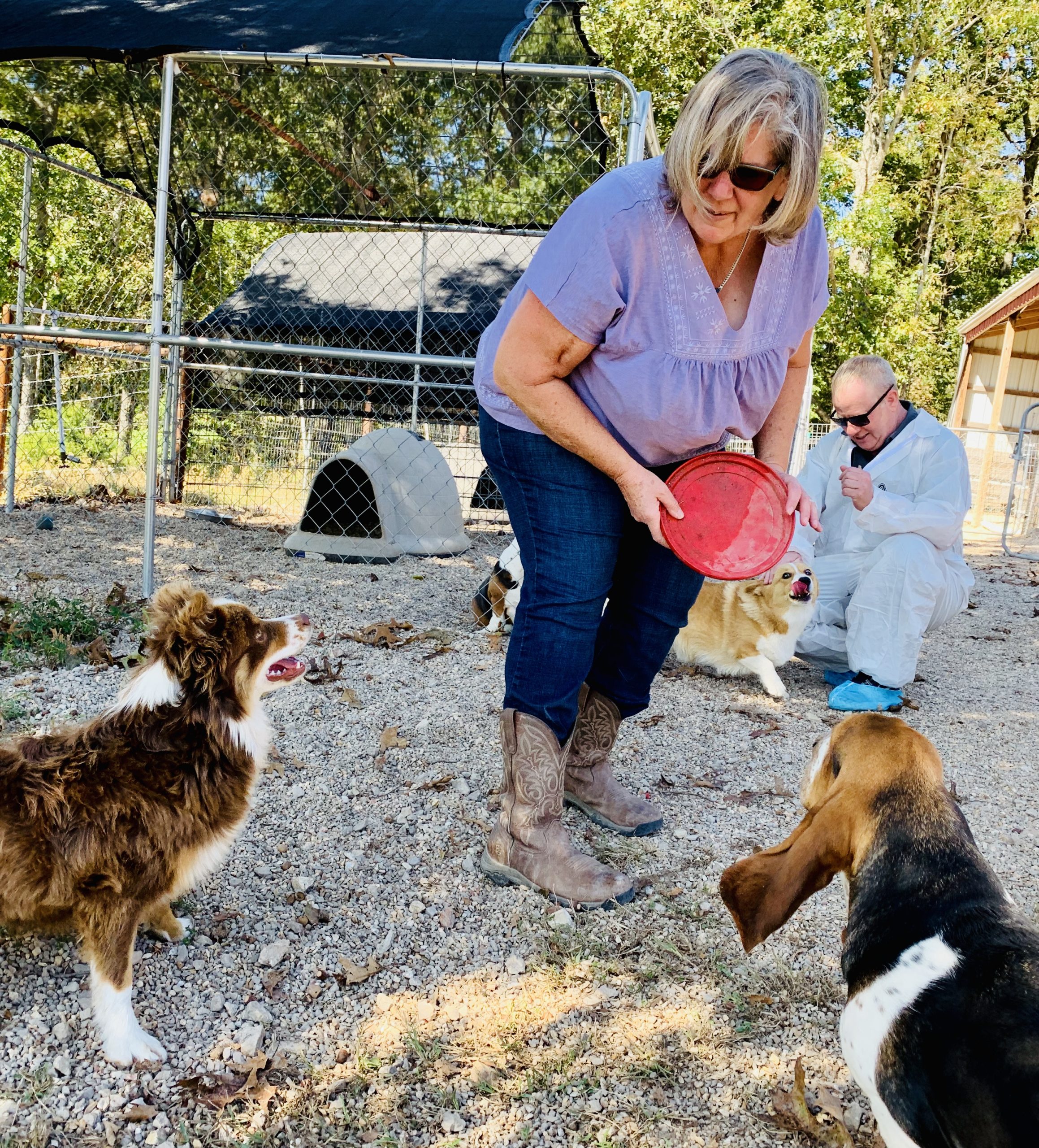 Nancy playing with her dogs