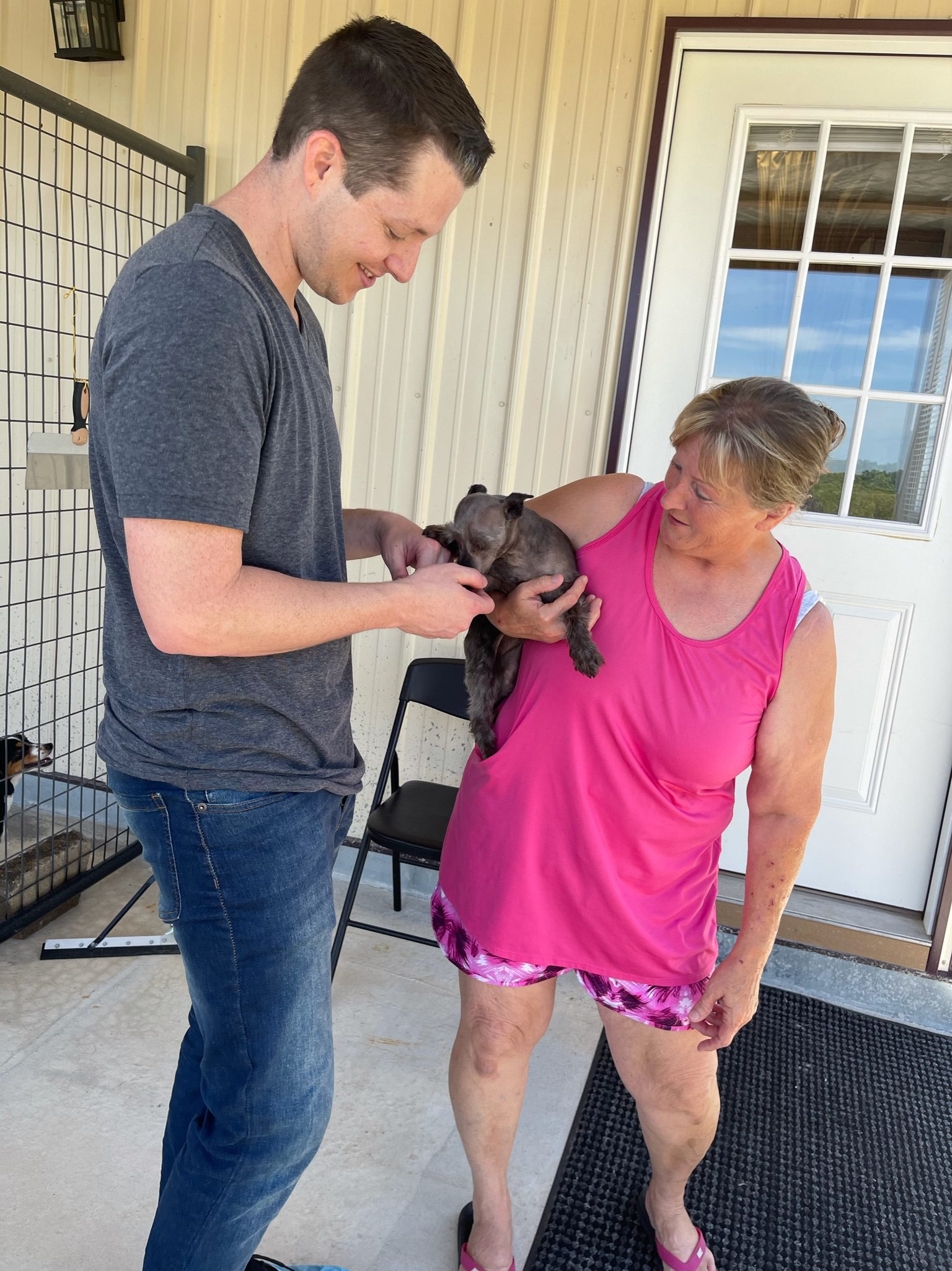 Jason says hello to Sharrie and her dog