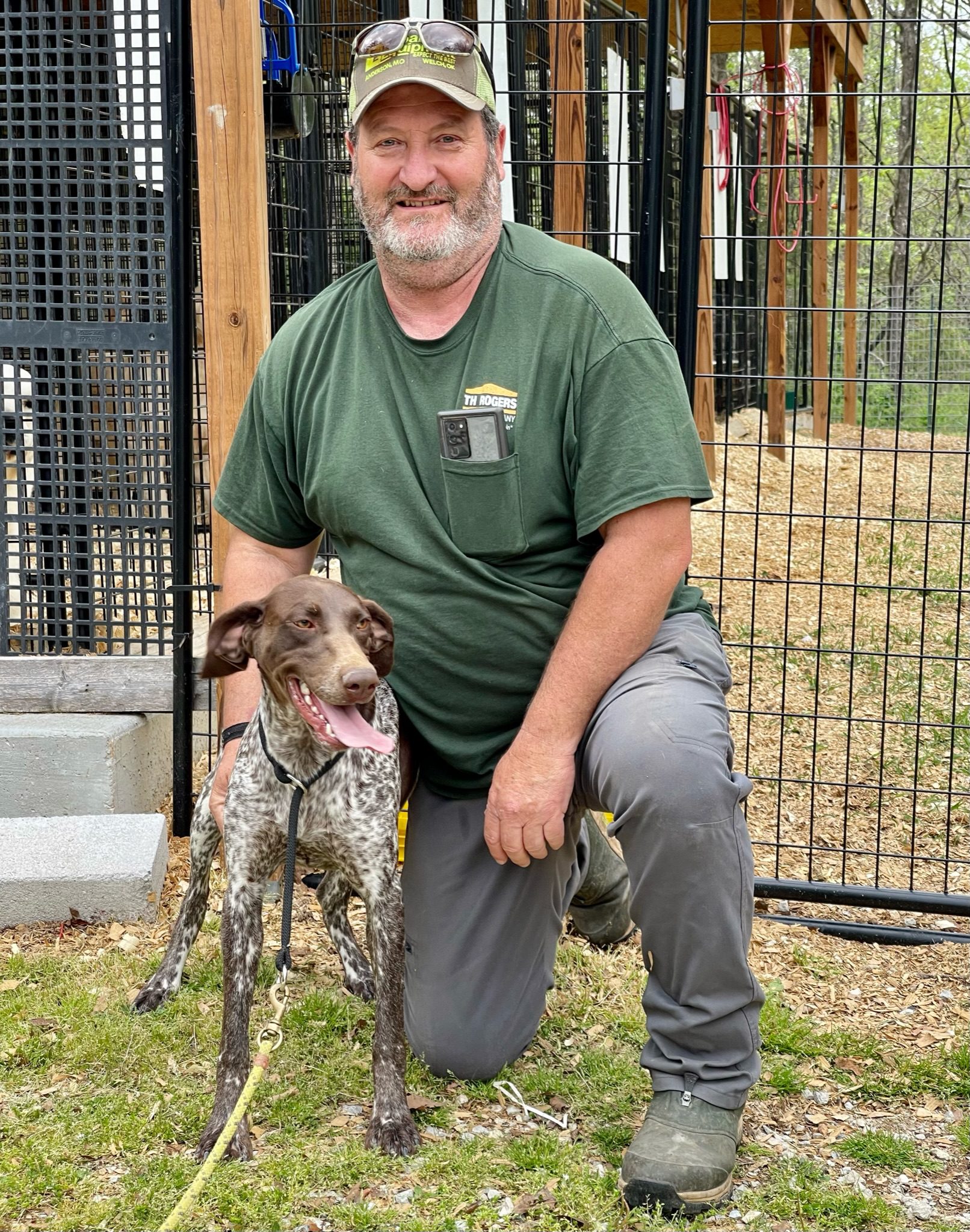 Danny poses for a picture with one of his dogs