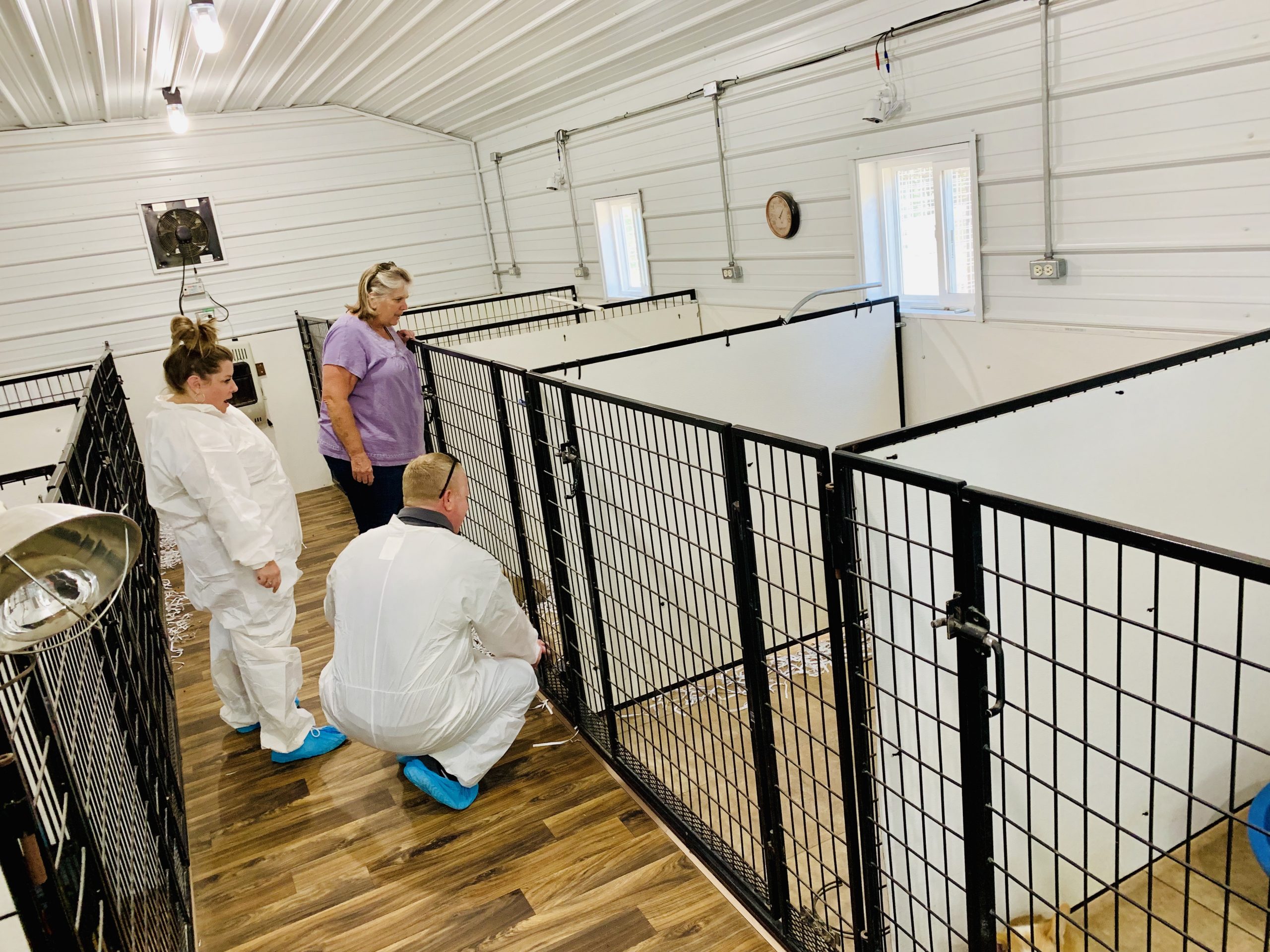 Frank Mineo Jr inspecting Nancy's kennel