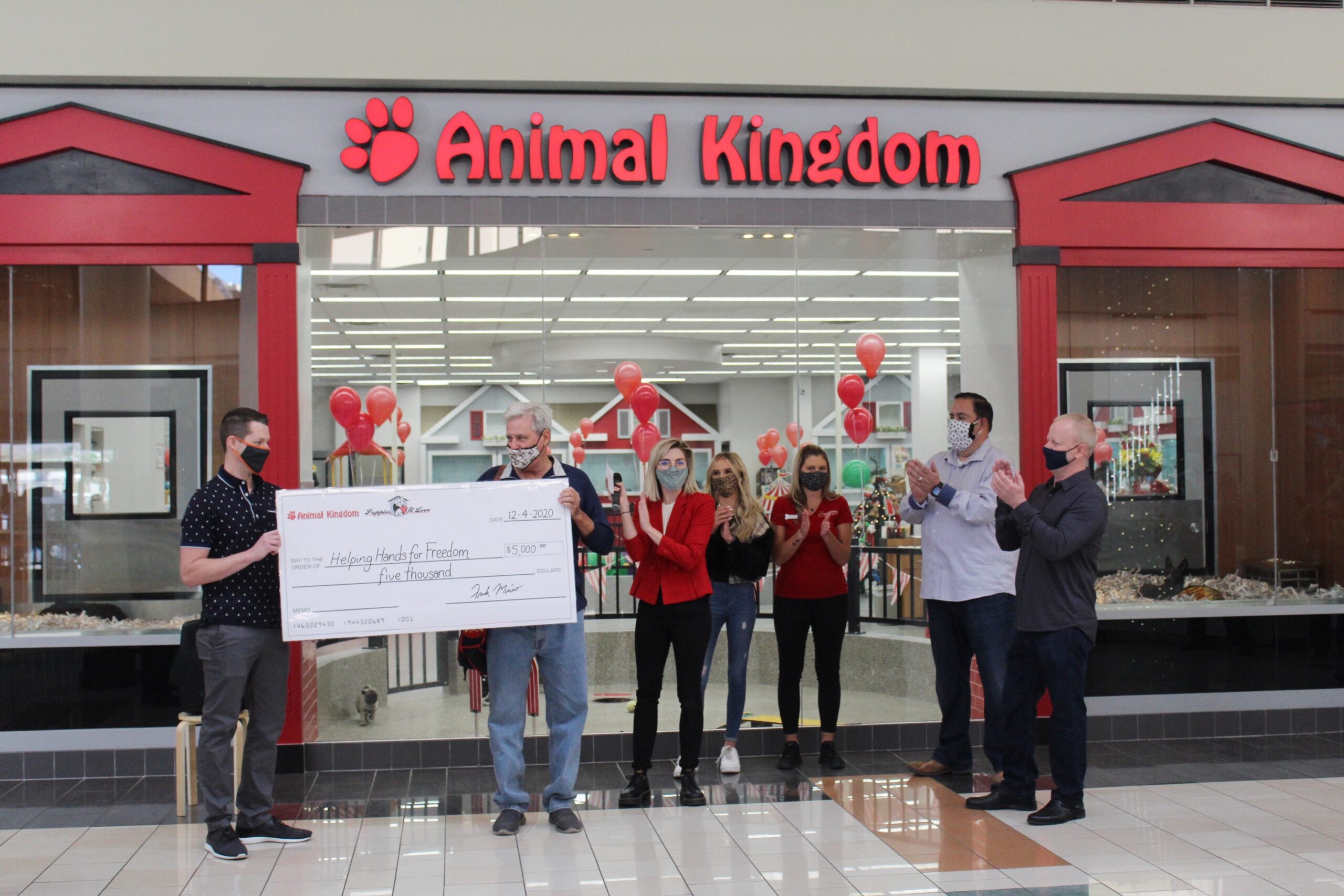 Eric accepting donation from Animal Kingdom